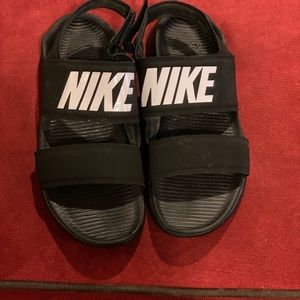 Black NIKE TANJUN sandals with Velcro straps